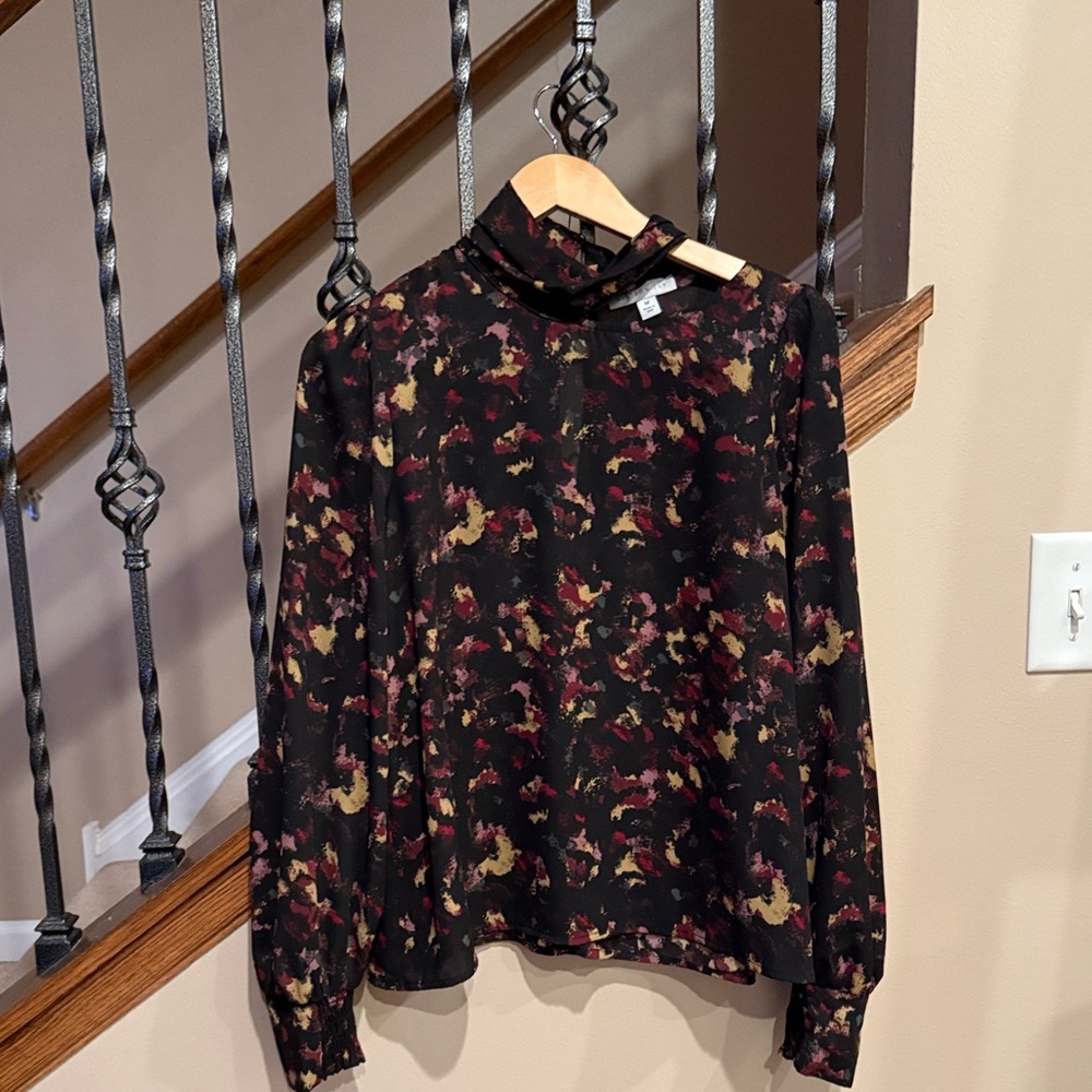 Allison Joy Abstract Print Blouse with cute cut out neck.